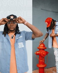 a man is standing next to a fire hydrant